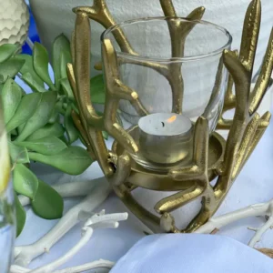 Ljuslykta korall i guld